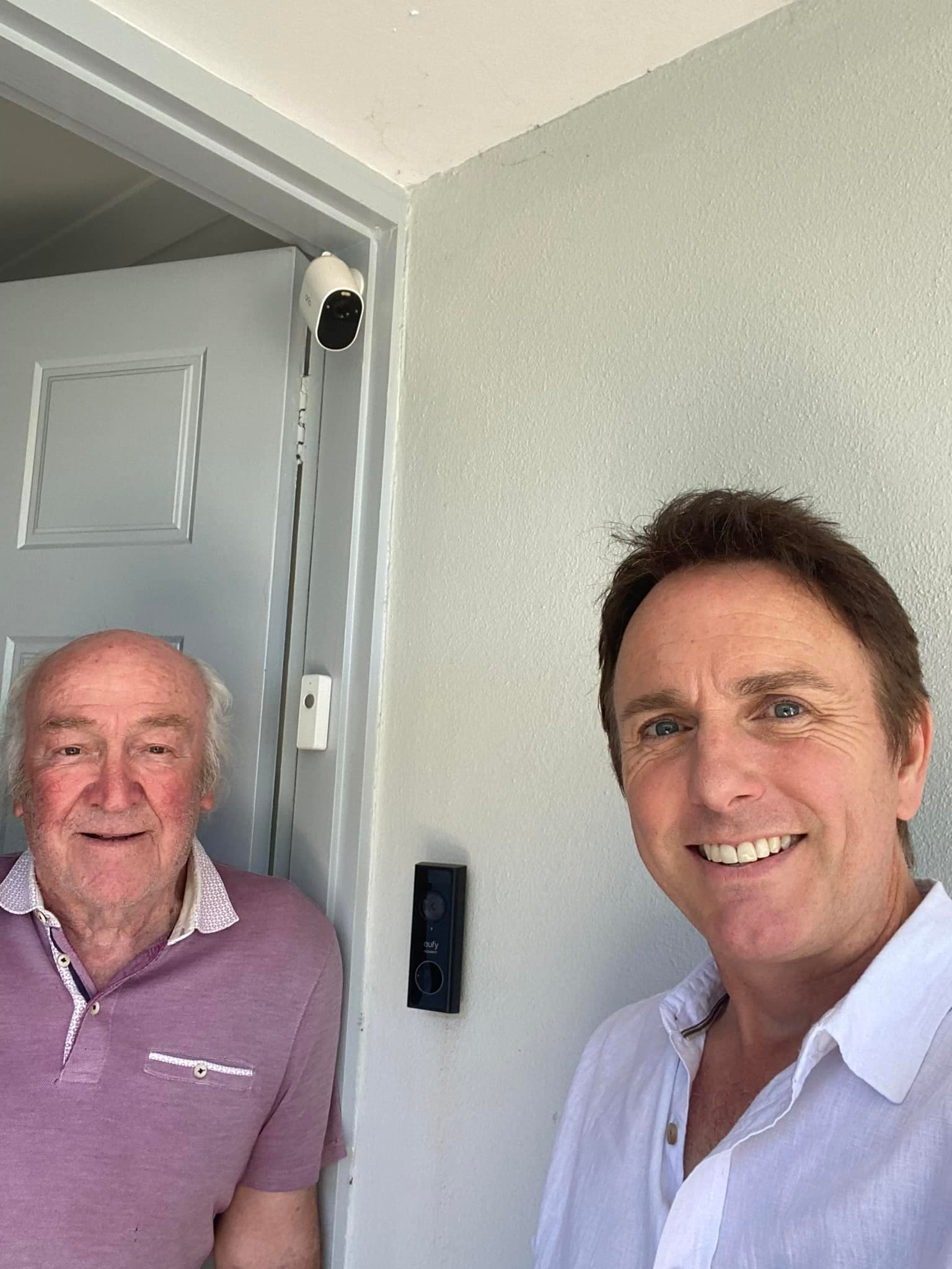 Innogreen technician with a senior customer next to their newly installed video doorbell